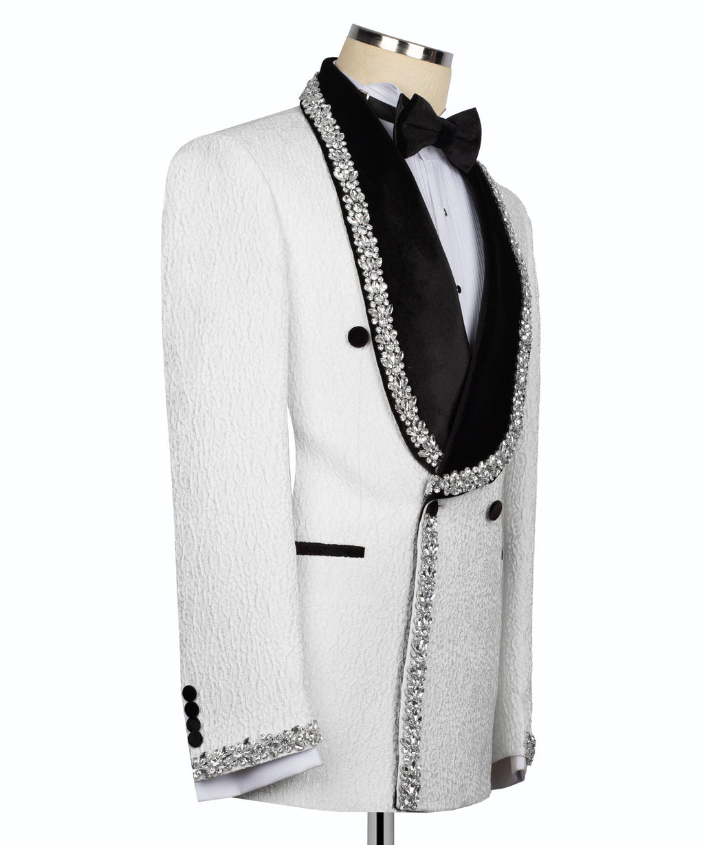 Stone-embroidered tuxedo jacket with black bow tie, vest, and rhinestone trim