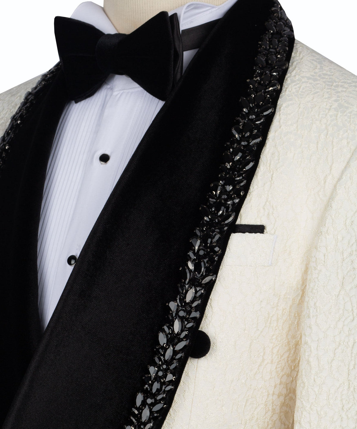 Close-up of black stone-embroidered lapel and bow tie on tuxedo jacket