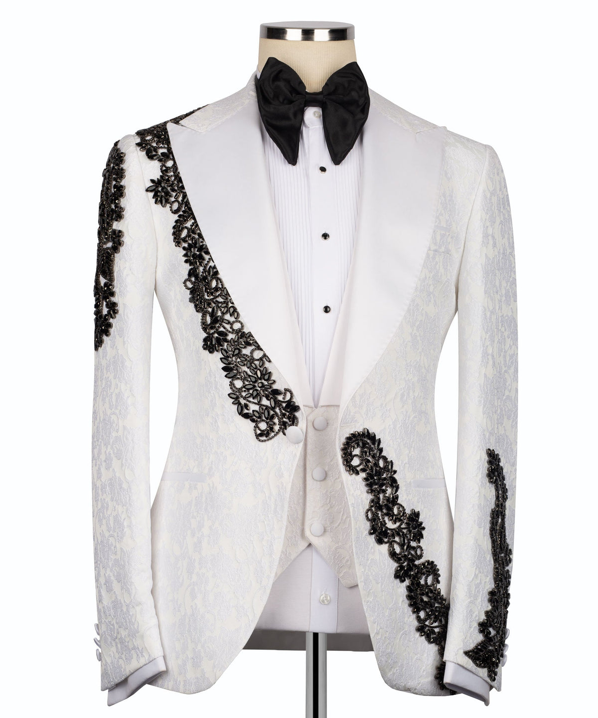 White tuxedo jacket, black stone-embellished lapel and cuffs, with black bow tie