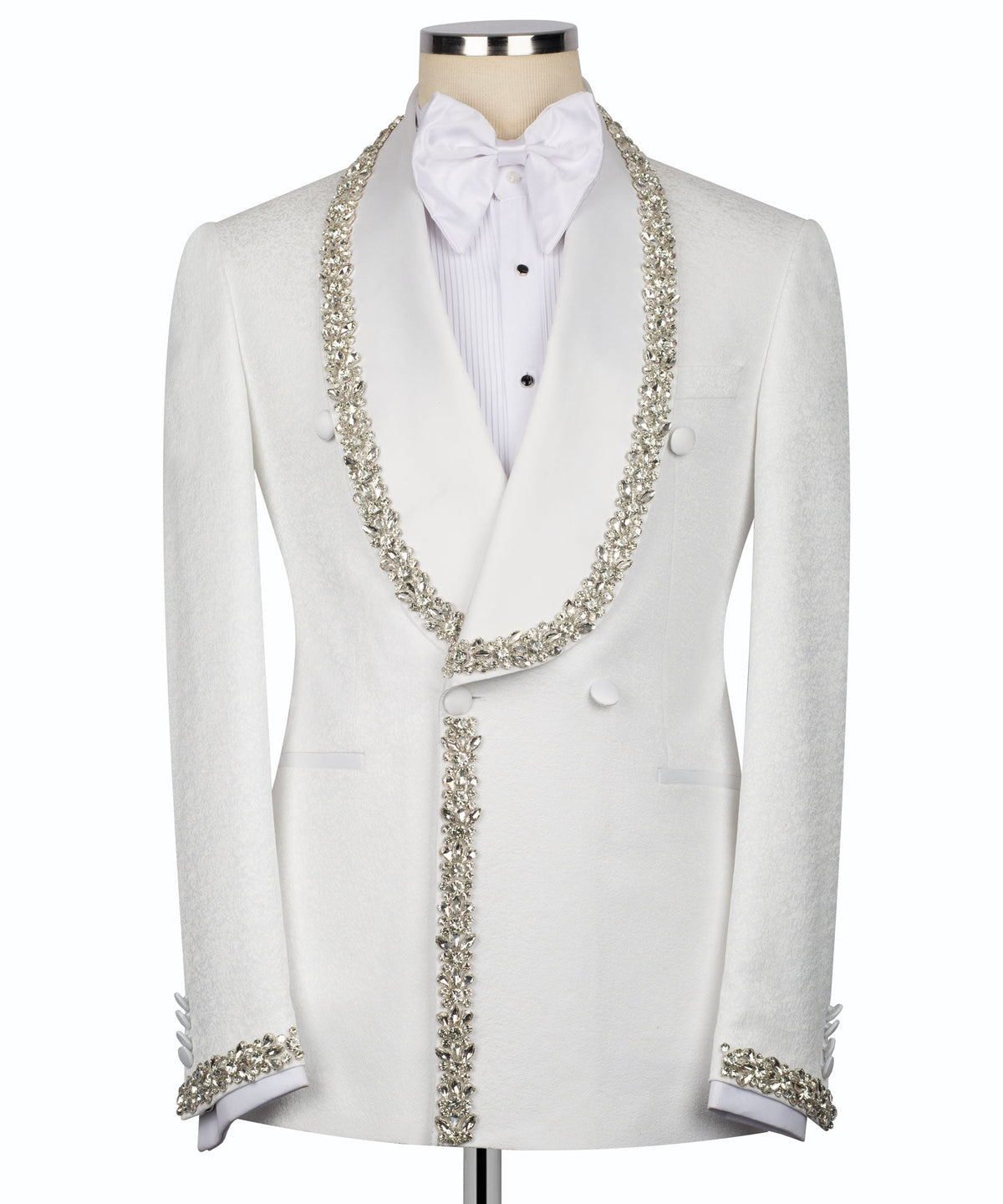 White tuxedo with silver stone-embroidered trim, bow tie, and waistcoat