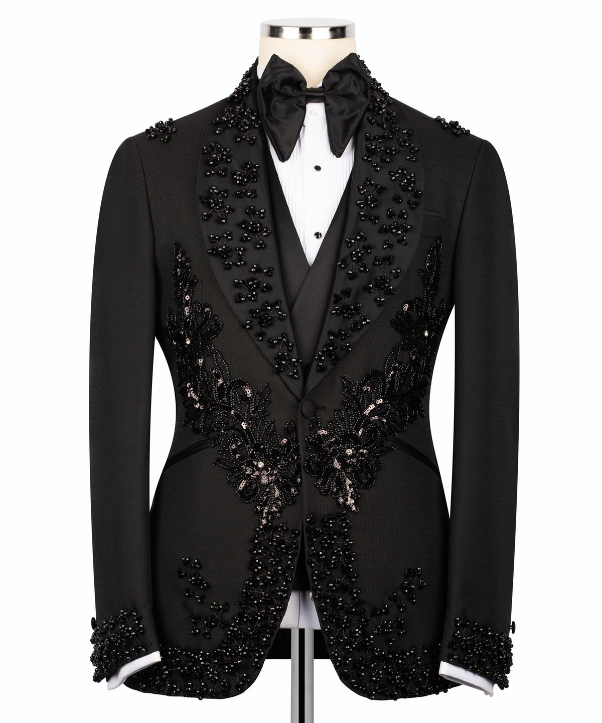 Black embroidered tuxedo suit front view with floral appliques on the vest