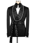 Black tuxedo with bow tie, white shirt, crystal-embellished lapels and belt sash