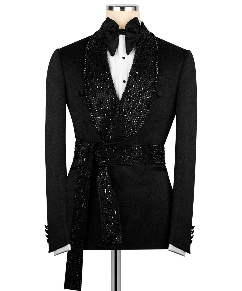Black tuxedo jacket with stone-embroidered V-lapel, satin bow tie, belted waist