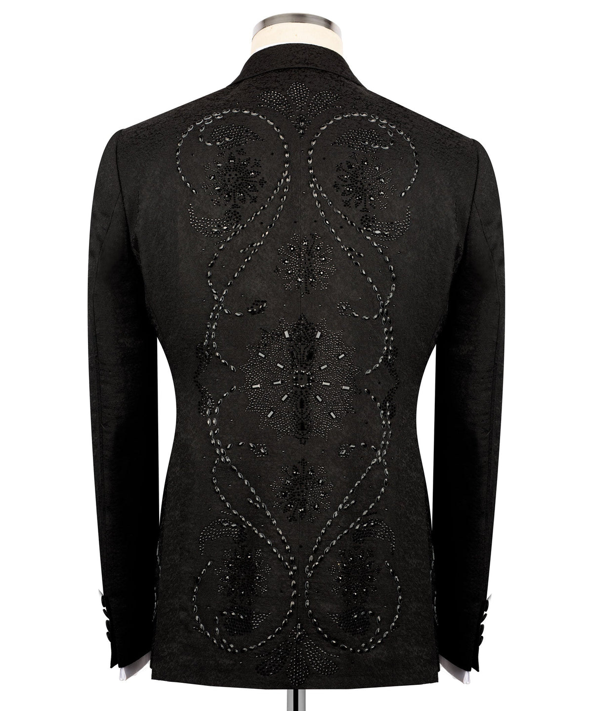 Back view of black embroidered tuxedo jacket with ornate circular and starburst motifs