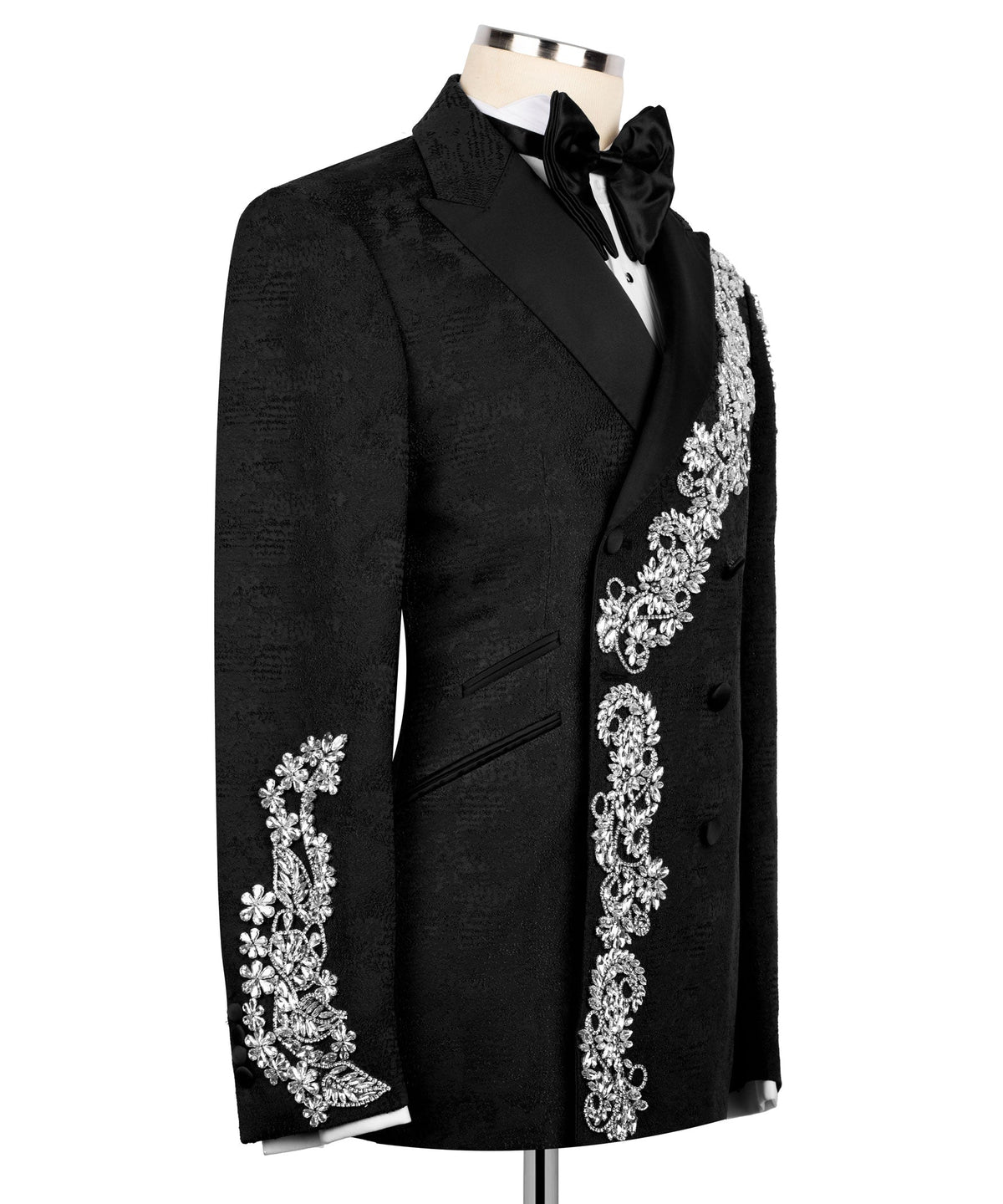 Black tuxedo jacket, side view, silver embroidered floral trim on pocket and sleeve