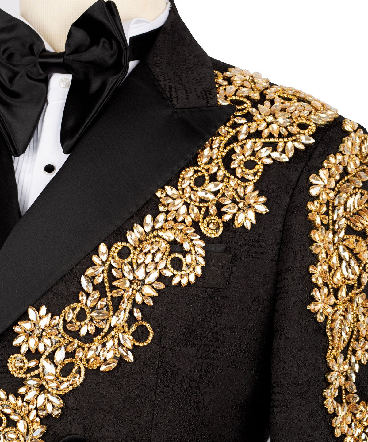 Gold stone-embellished embroidery on black tuxedo lapel and front panel with bow detail