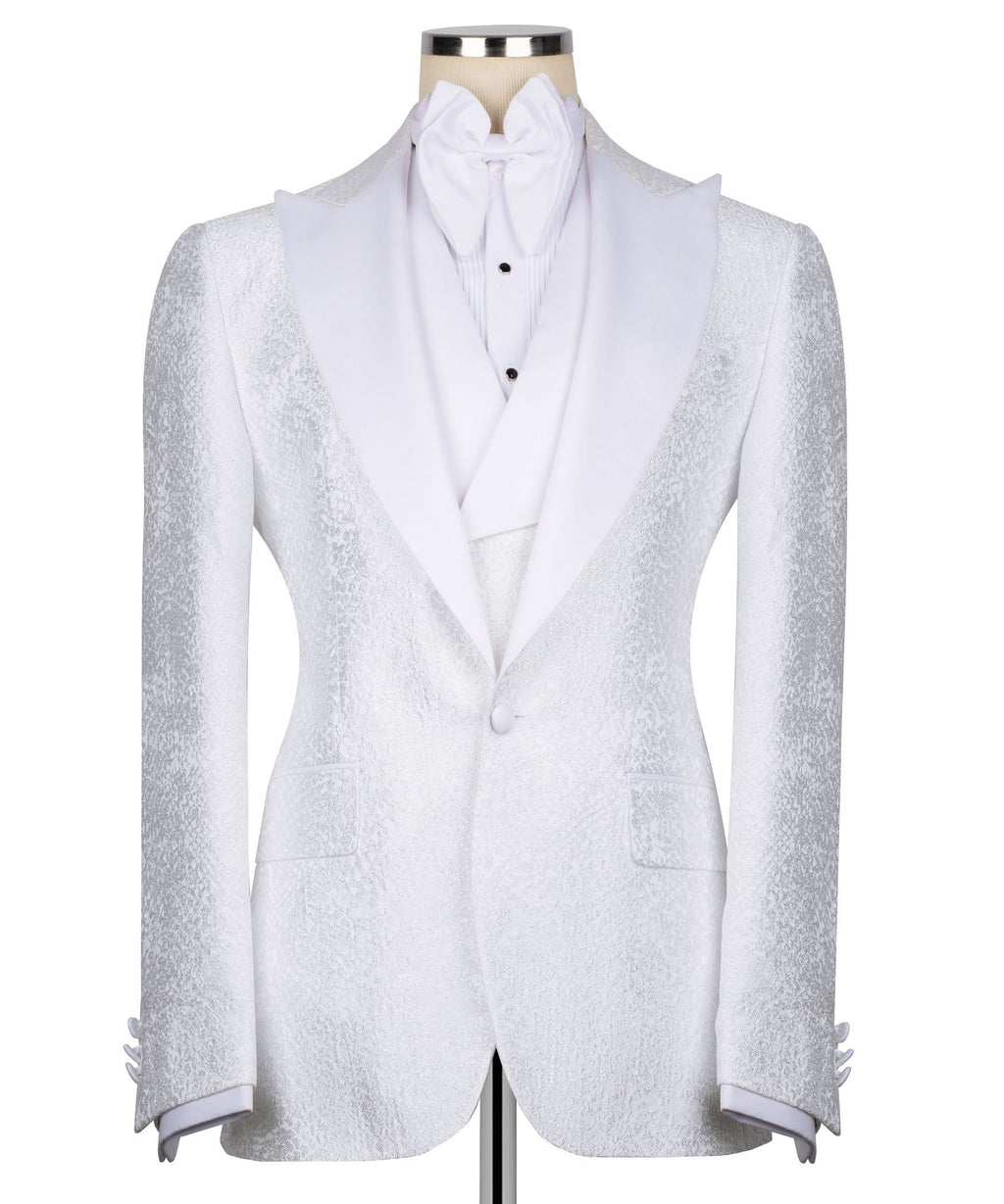 White tuxedo jacket with single-button front, textured lapels, bow collar and vest