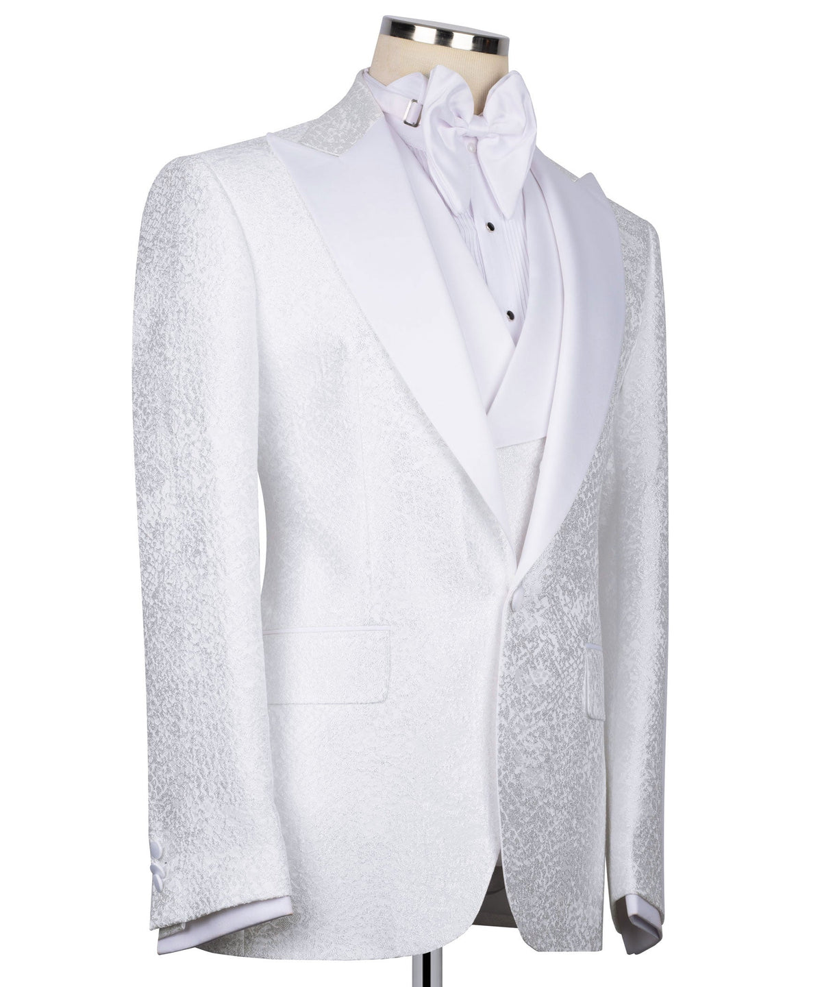 White tuxedo jacket front with embroidered trim, bow tie, and waistcoat