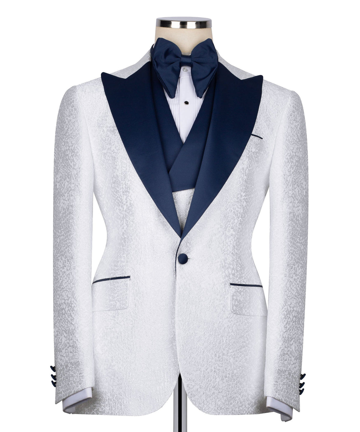 White tuxedo jacket on mannequin with navy shawl collar and bow tie