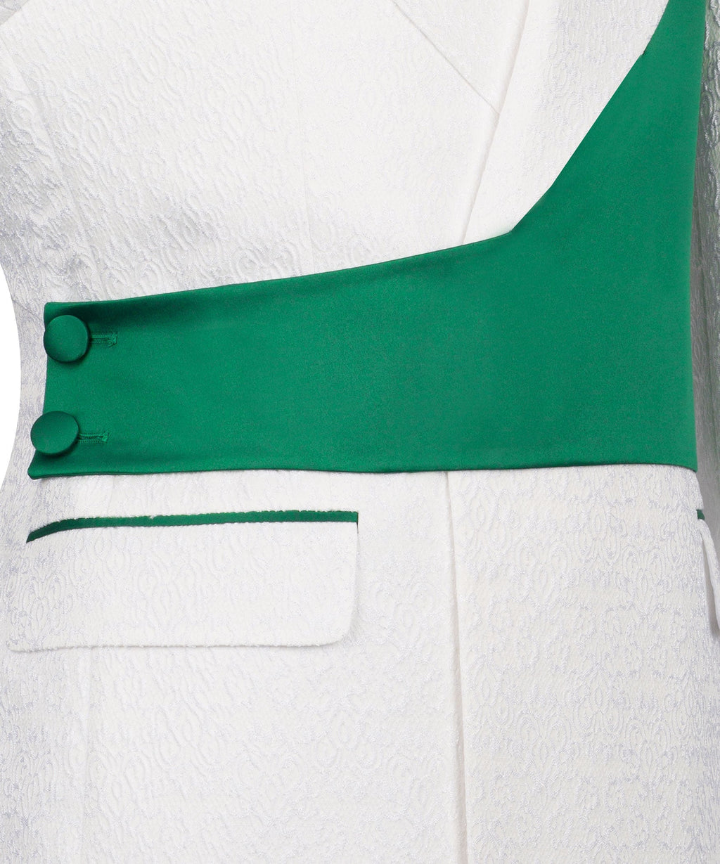 Green vest panel with two buttons over white textured fabric and pocket stripe