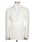 Cream tuxedo blazer with notch lapels, white bow tie and vest, three-piece set
