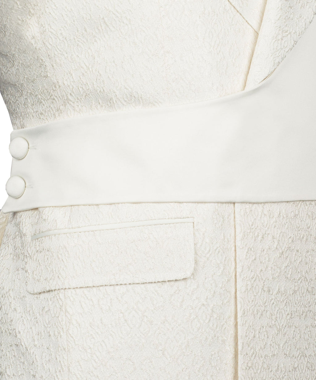 Cream vest front with two-button closure and jetted pocket detail