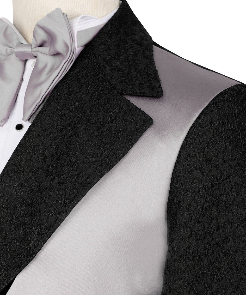 Close-up: black textured lapel, light-gray satin vest, and light-gray bow tie