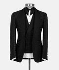 Black glitter tuxedo jacket with satin lapels and bow tie over white shirt