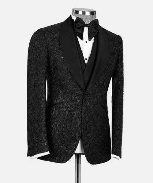 Black glitter tuxedo jacket front view with satin lapels and bow tie