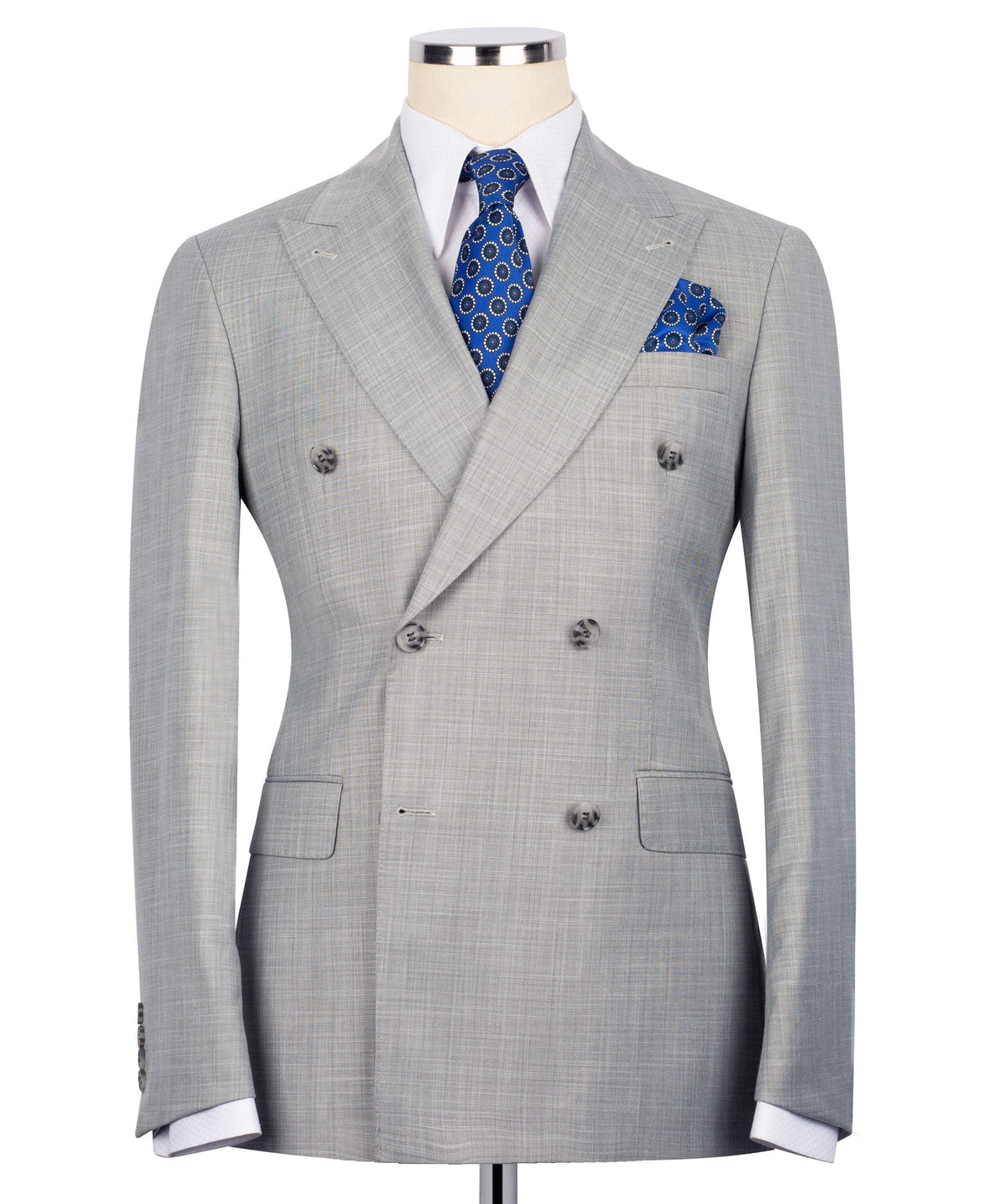 Gray double-breasted suit jacket with notch lapels, blue patterned tie, and pocket square