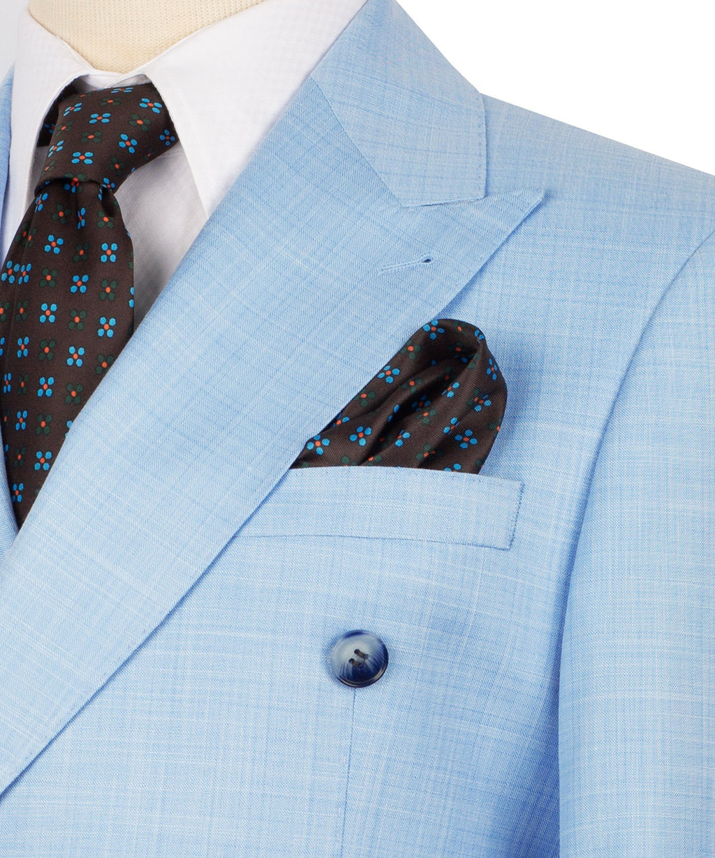 Close-up of light blue jacket lapel, round button, and folded matching pocket square