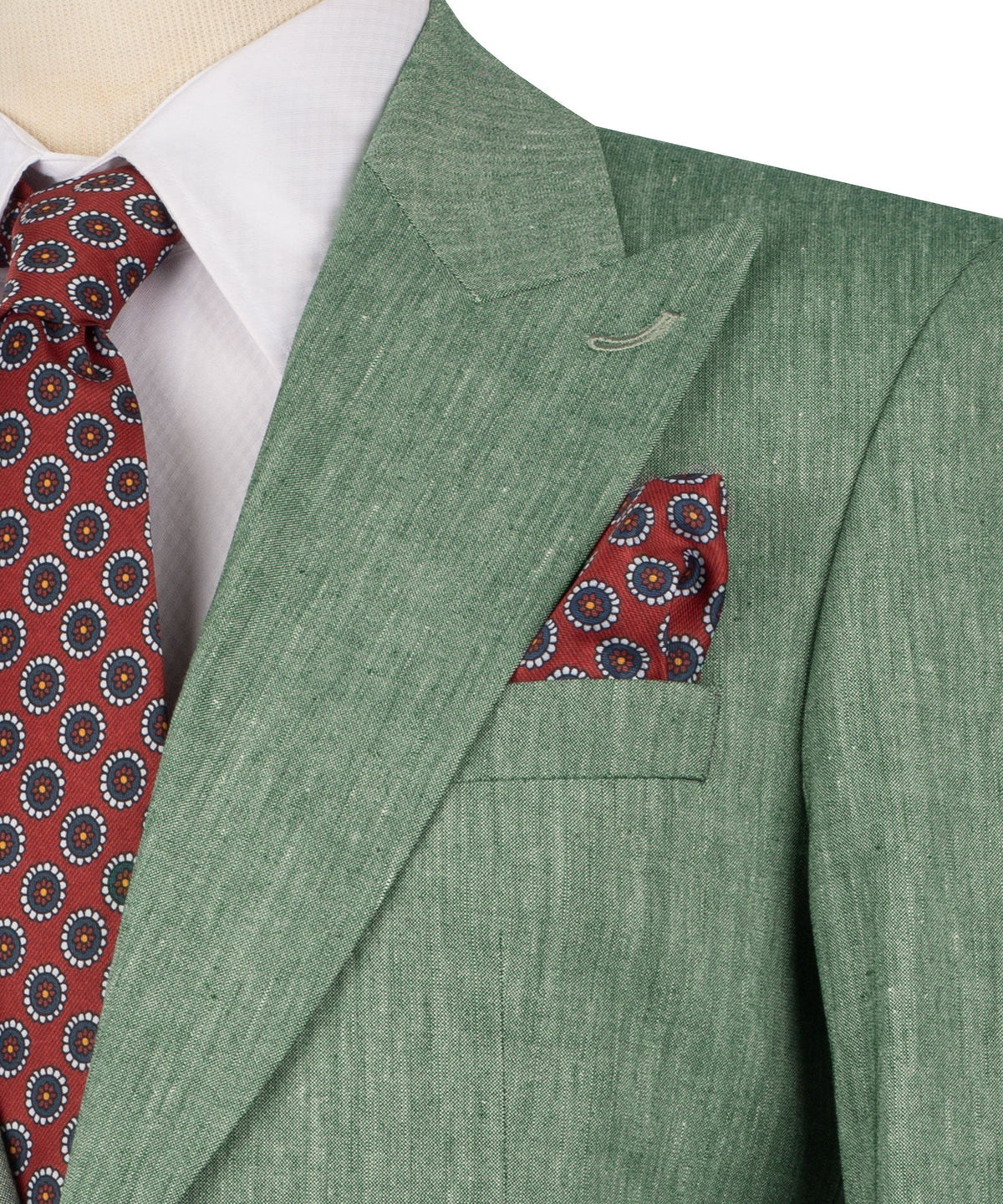Close-up: green linen blazer with flap pocket and red patterned pocket square