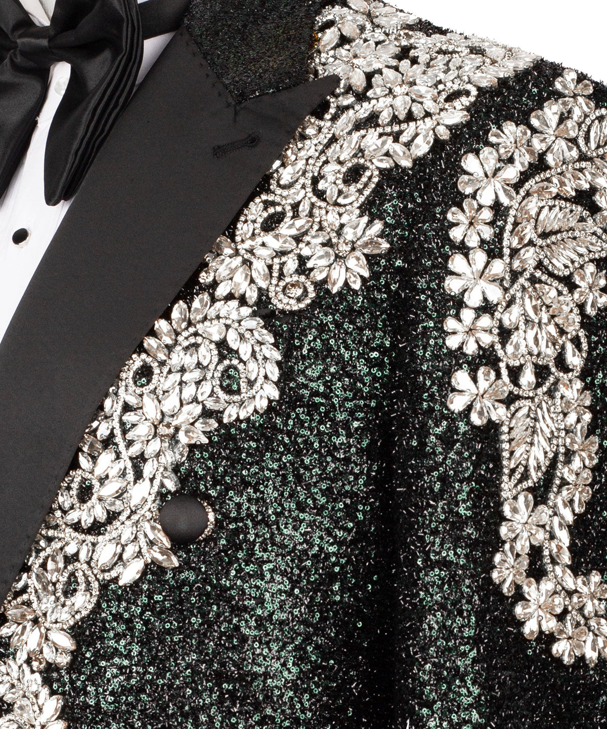 Close-up: silver stone floral embroidery on black tuxedo jacket sleeve and shoulder