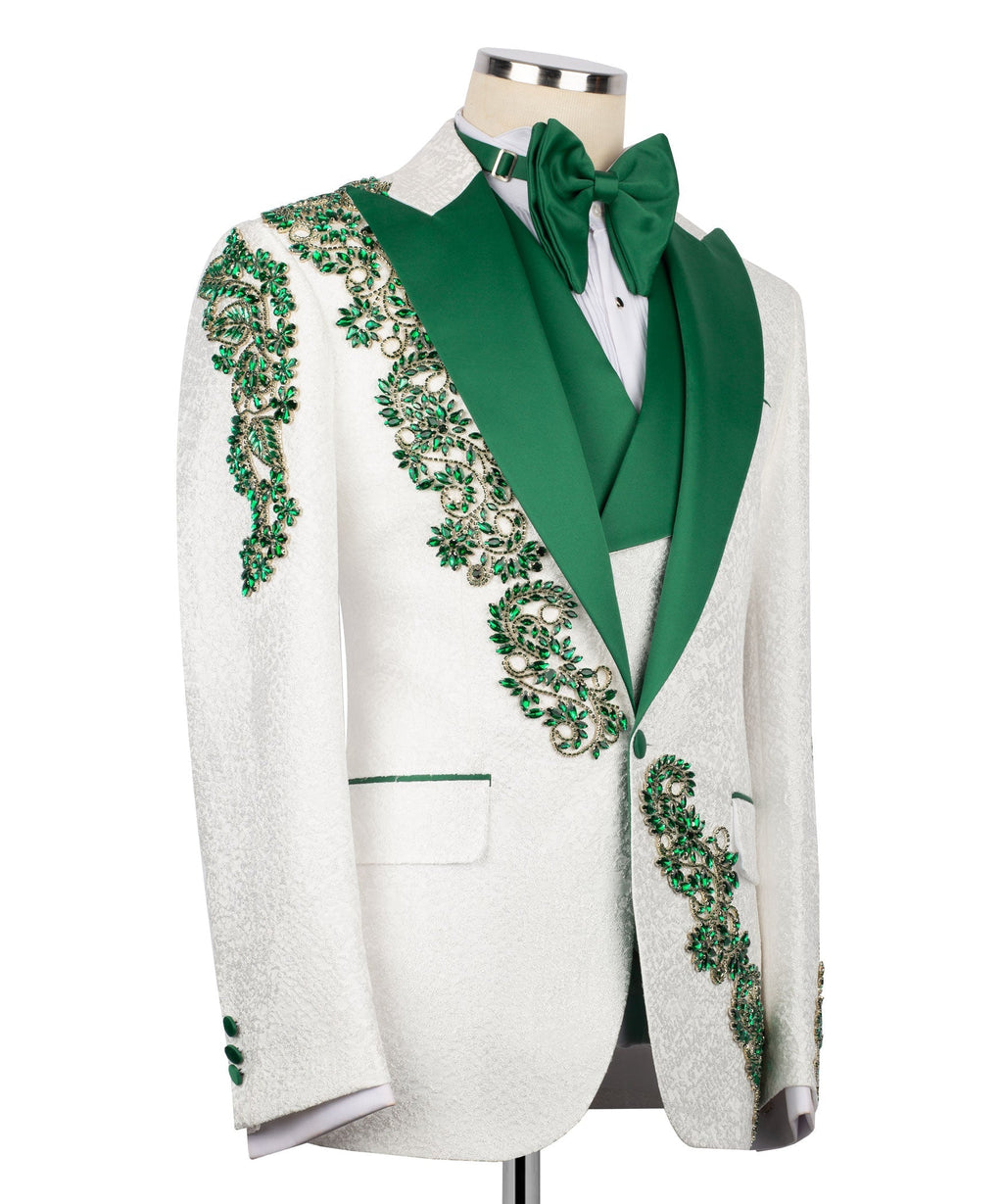 Side view: white tuxedo jacket with green shawl lapel, bow tie, and emerald stone embroidery