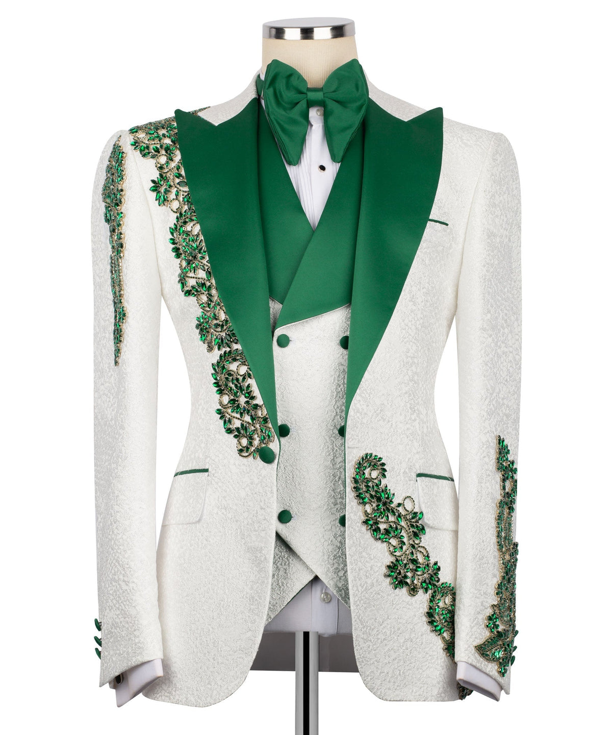 Green lapels and vest buttons on white tuxedo, with emerald stone embroidery details