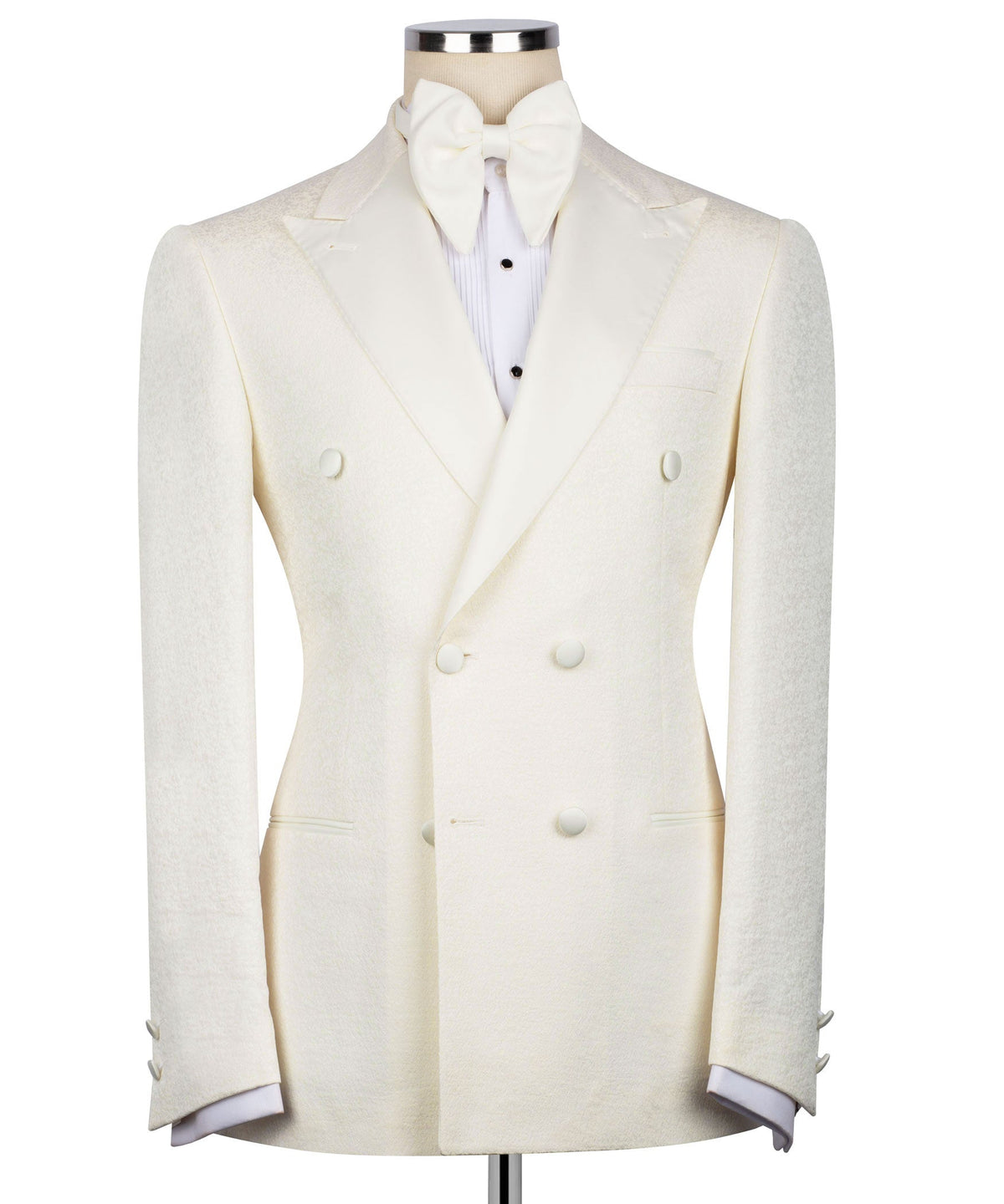Cream tuxedo jacket with bow tie; double-breasted vest front with dark buttons