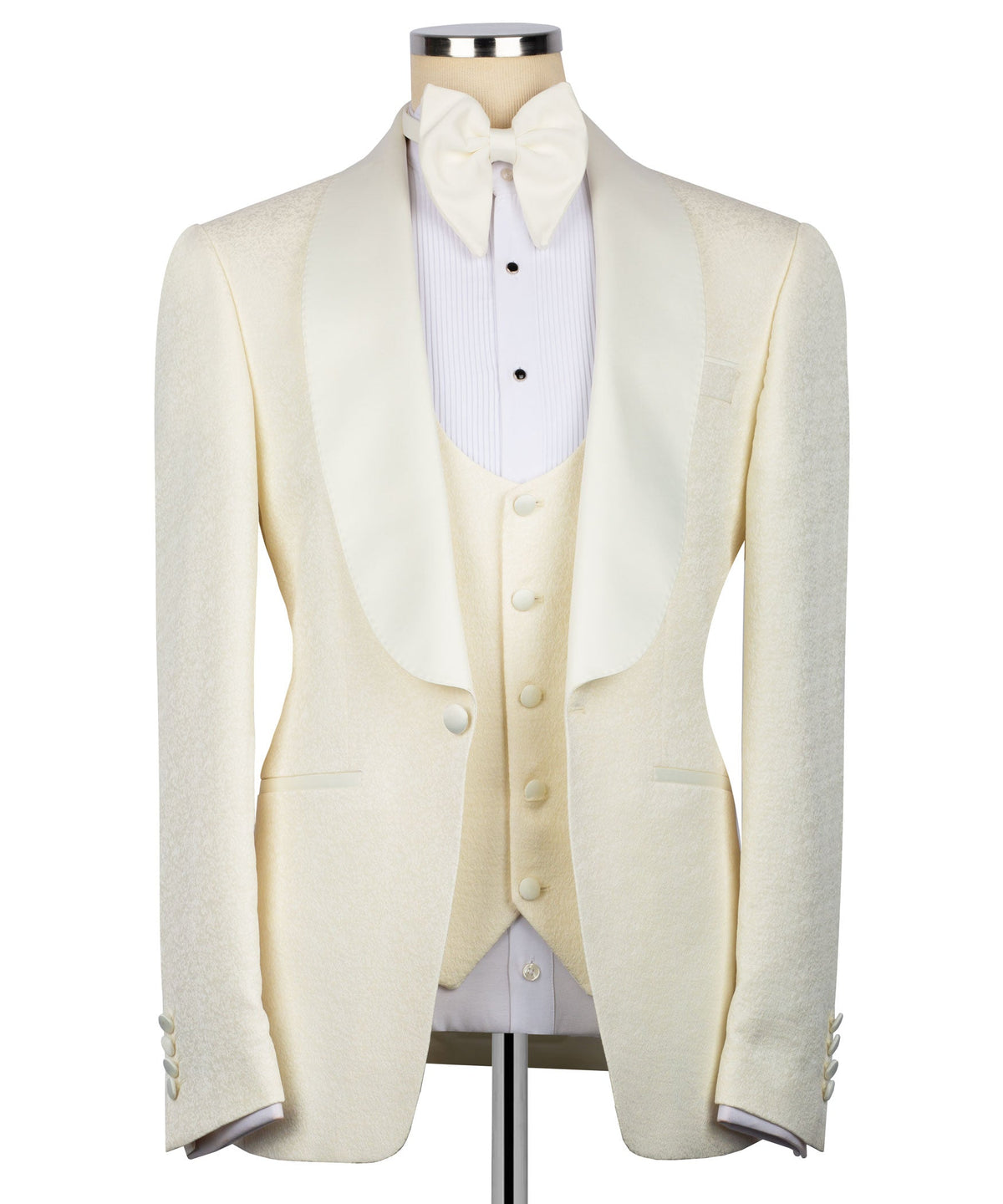 Cream three-piece tuxedo suit set with bow tie, vest, and tailored jacket front