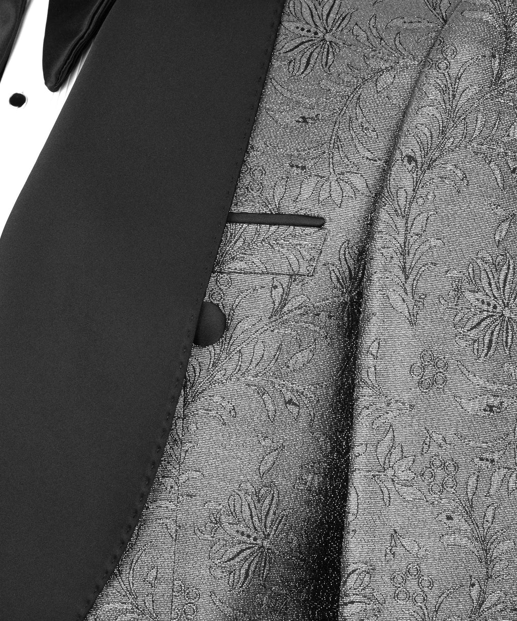 Shiny tuxedo jacket detail: metallic silver floral fabric with black satin lapel