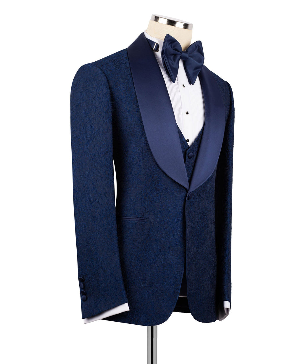 Navy tuxedo suit jacket with vest and bow tie, shown from the side