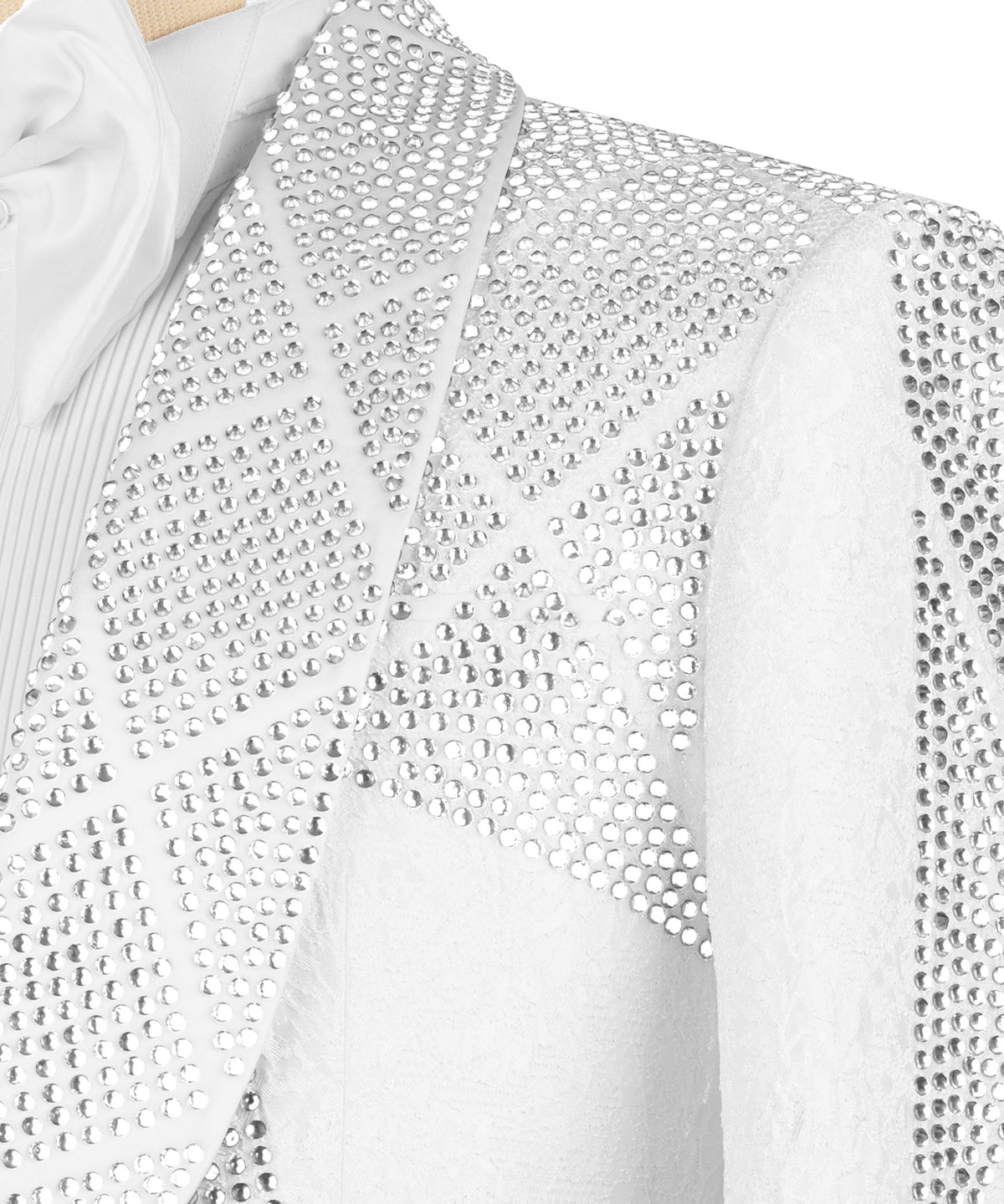 Close-up of white stone-embroidered tuxedo jacket fabric with dense rhinestone texture
