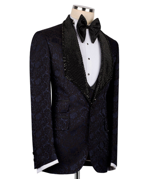 Navy patterned tuxedo jacket with black sequin velvet trim and bow tie, white shirt and vest