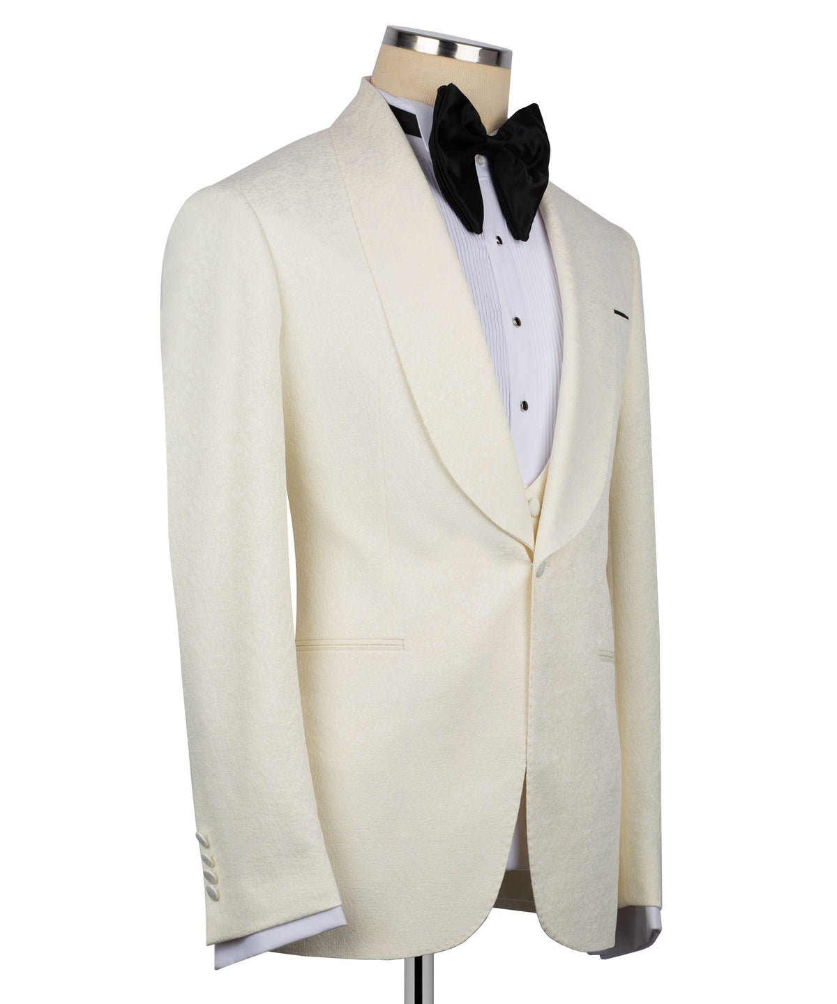 Cream tuxedo jacket front with notch lapels, white shirt, and black bow tie