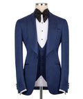 Navy textured tuxedo jacket with black satin bow tie and white striped shirt