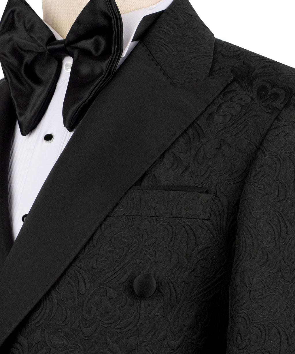 Close-up of black tuxedo lapel, bow tie, and textured pocket flap