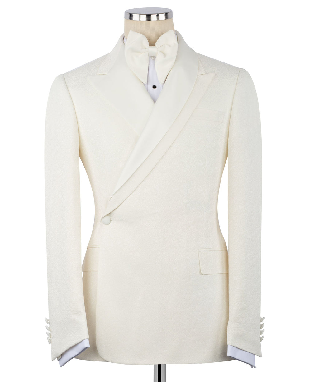 Cream double-breasted tuxedo blazer with satin lapels and bow tie at the neckline
