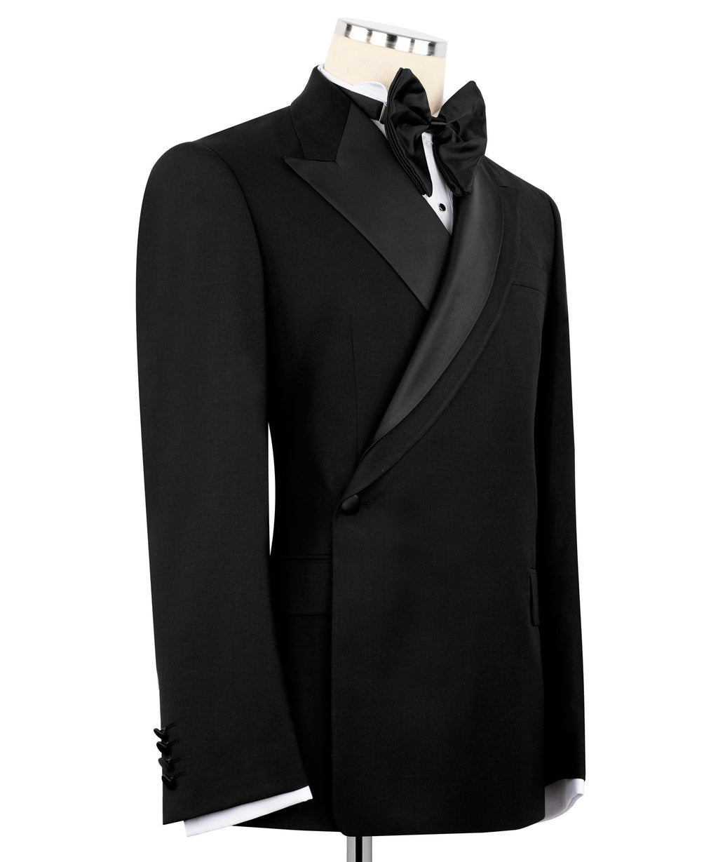 Black tuxedo jacket with bow tie, notch lapels, and single pocket