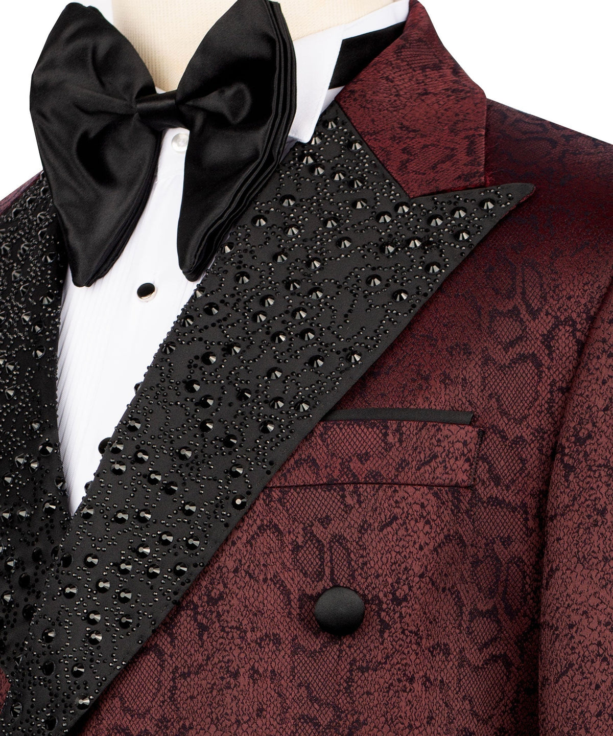 Close-up: burgundy patterned pocket and lapel with black beaded trim, satin bow tie