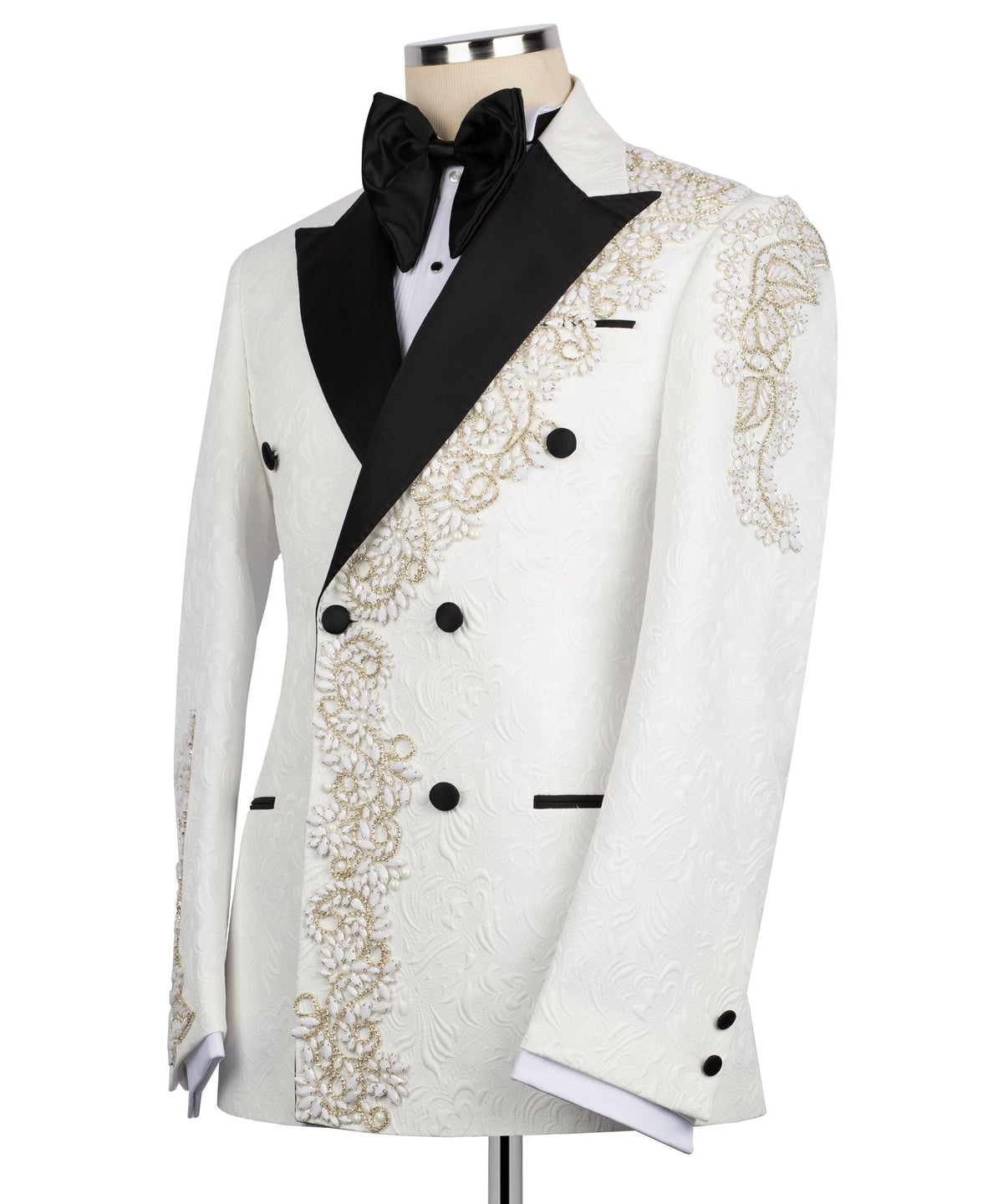 White tuxedo jacket with black bow tie, gold beadwork panels, and black buttons