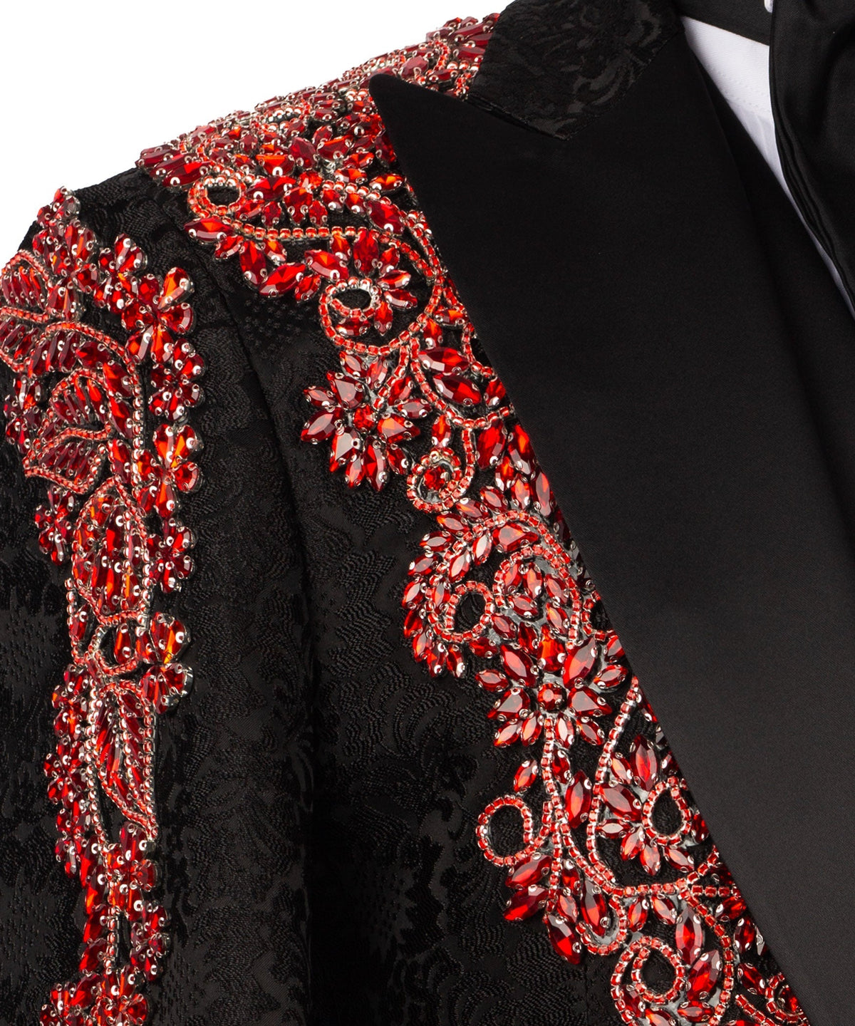 Close-up: black tuxedo jacket with red jeweled embroidery and beaded details