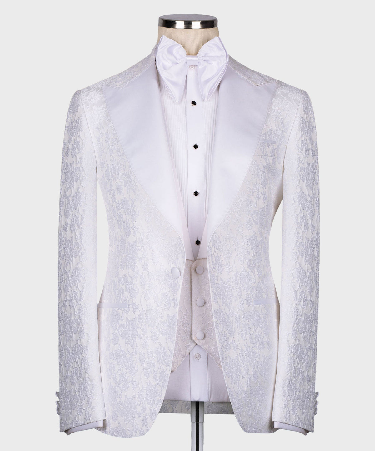 White pointed-collar tuxedo jacket with matching waistcoat and bow tie, three-piece set