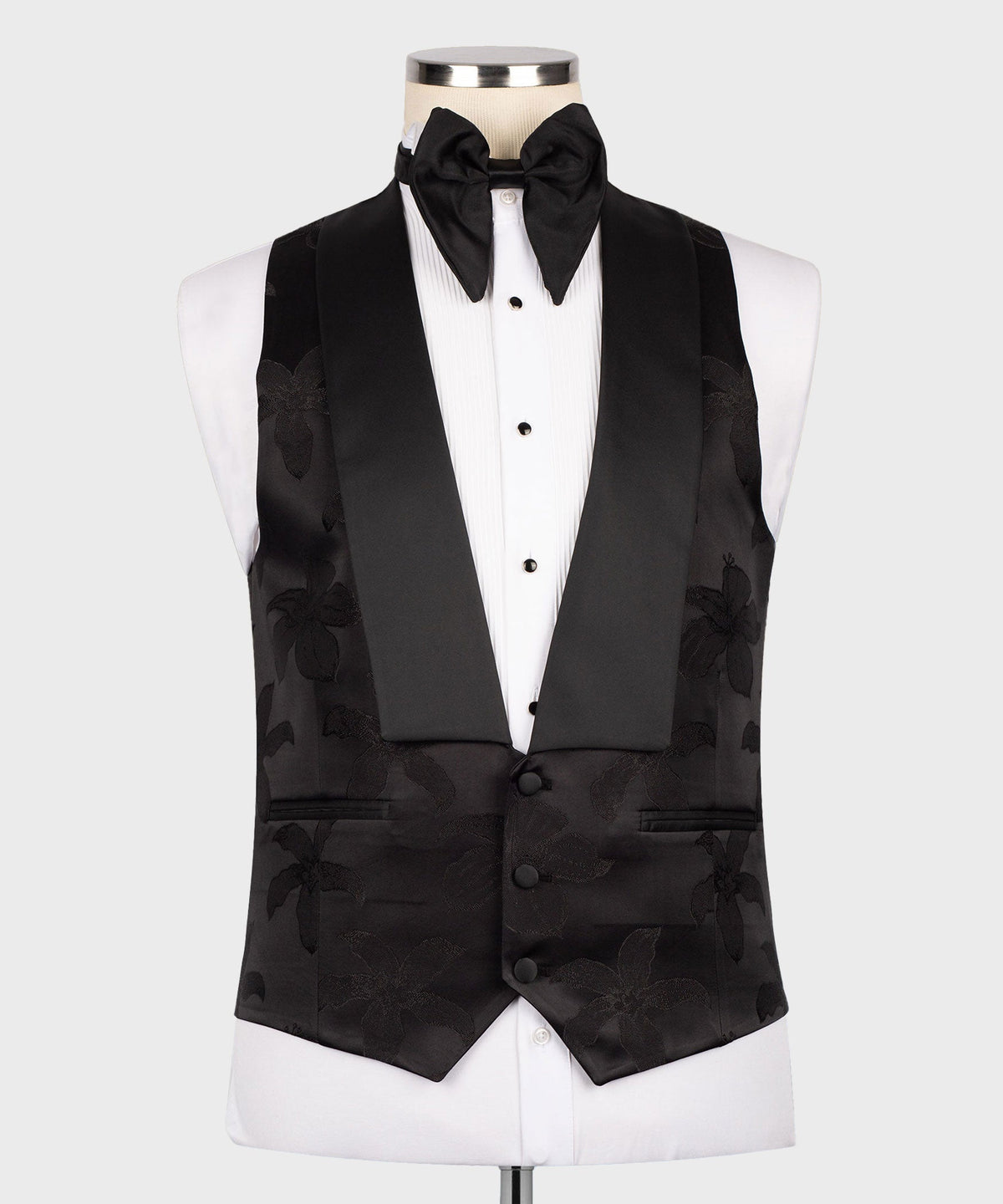 Black three-piece tuxedo set with bow tie, floral jacquard vest, and matching jacket